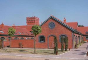 Plum Red tiles with made to order crested ridges and finials